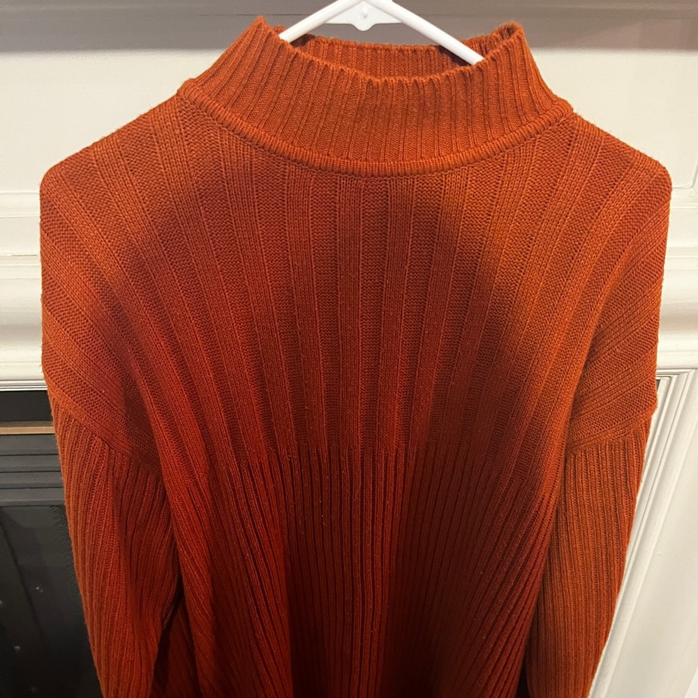 Orange , burnt orange sweater.   Size M in men.  Lightly used